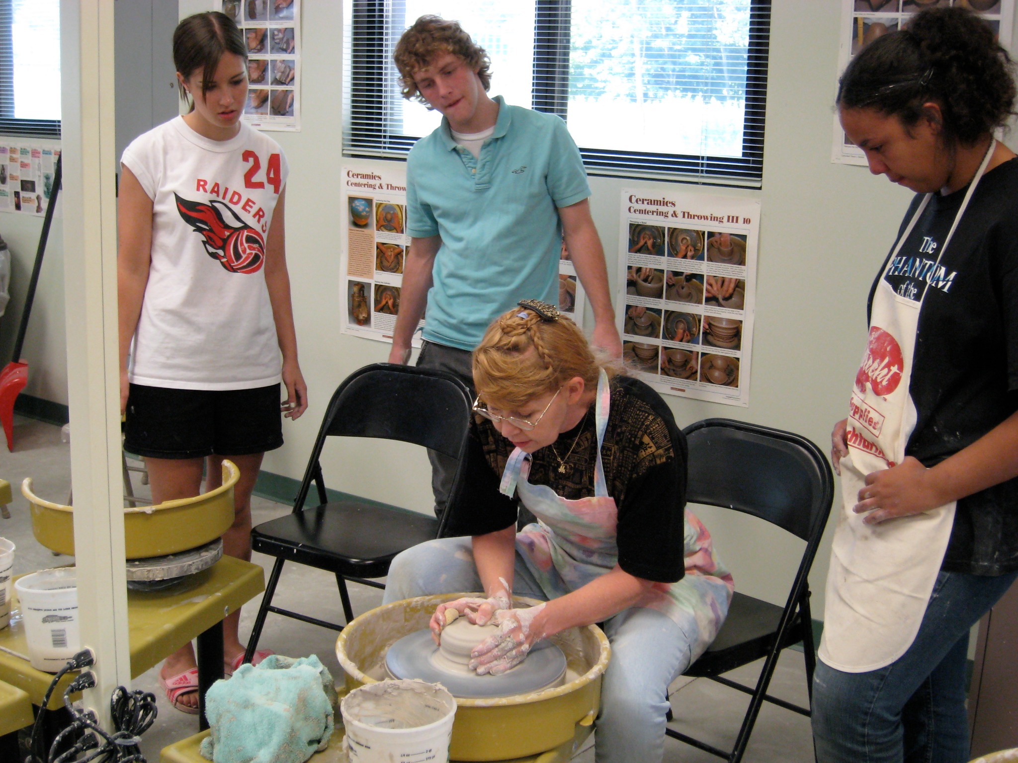 Martie Geiger-Ho teaching ceramics with students at the University of Pittsburgh at Bradford in 2007.