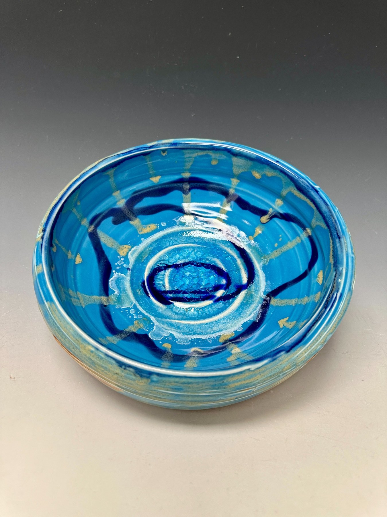 Astral Bowl with turquoise-blue glaze and concentric center.