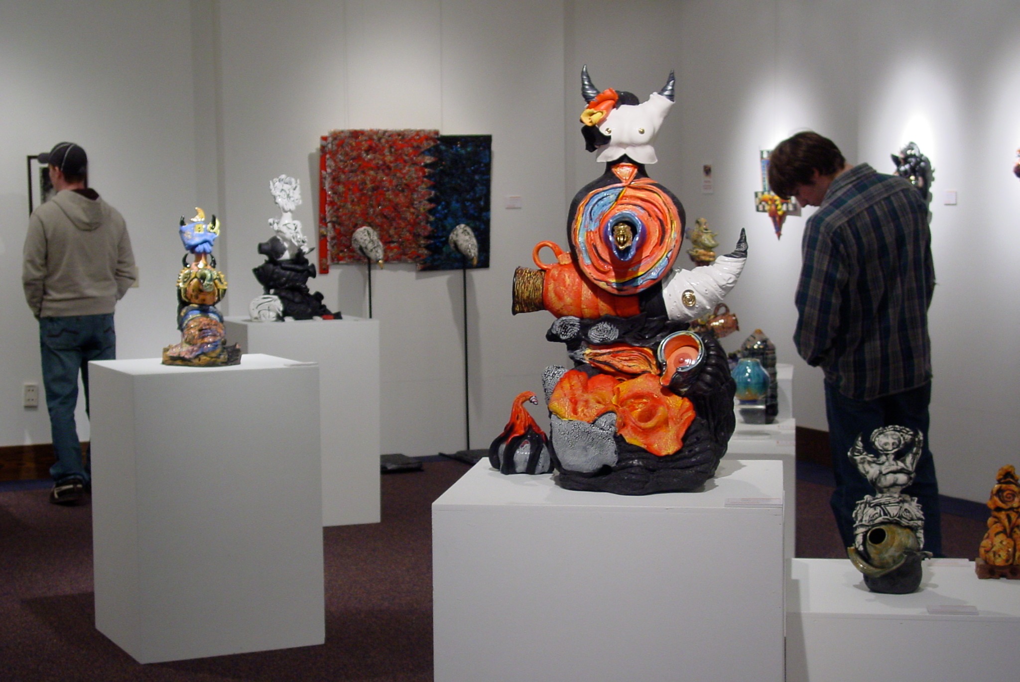 Gallery view of Playing with Fire and Kiln Gods with visitors