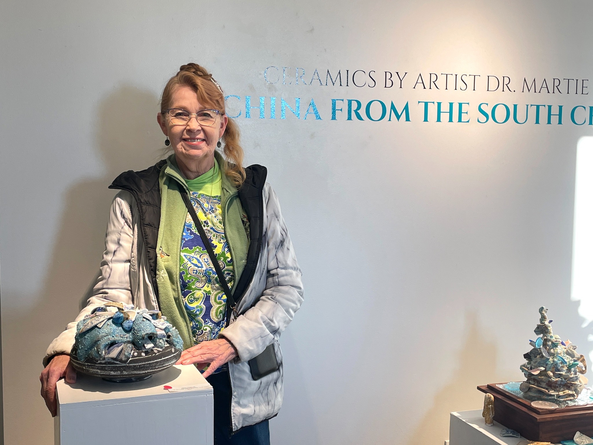 Martie Geiger-Ho with the exhibition.
